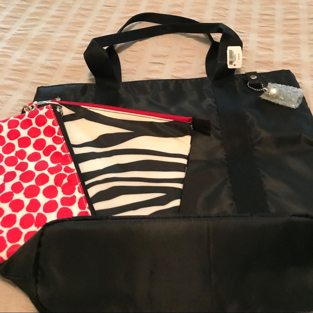 Water proof black tote w/2 cosmetic bags.